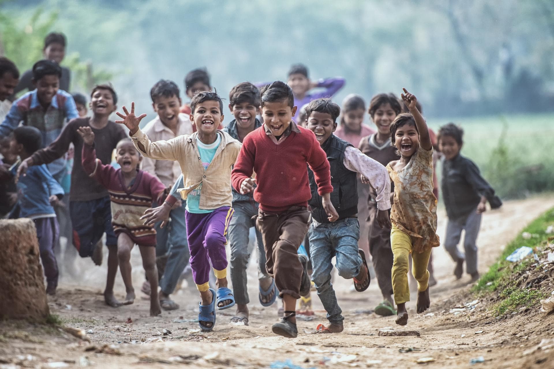 Children running and smiling outdoors